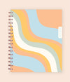 Enjoy tthis 2023 WAAV planner in 7x9 featuring a wavy cover in blue, orange, white, and green.
